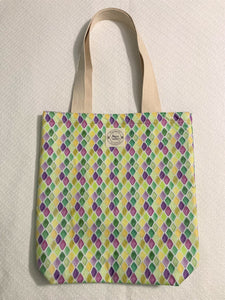 Take your Mardi Gras style with you wherever you go with the Nola diamonds small tote! This bag is made of 100% cotton and has vibrant purple and green diamonds on it, so it’s a stylish statement piece and sustainable too (who said you can't have it all?). Get your hands on this trendy bag ASAP!  All the materials are 100% cotton making it a sustainable item. This cute handmade tote bag is around 15 inches wide and 18 inches long with a 4 inch bottom.