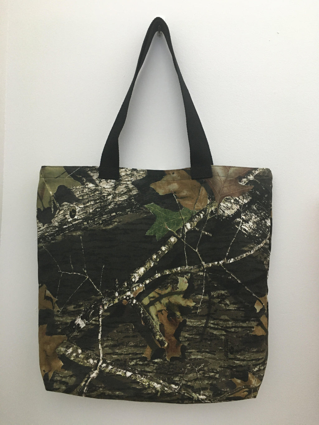 For those who like hunting or to just be in the wild, here is your camouflage handmade tote bag! All materials are 100% cotton, from the fabric, muslin lining, black trim, and thread. Machine wash normal, cold, mild detergent, no bleach, tumble dry low, cool iron. Measurements are around 16in x 19in x 4in.