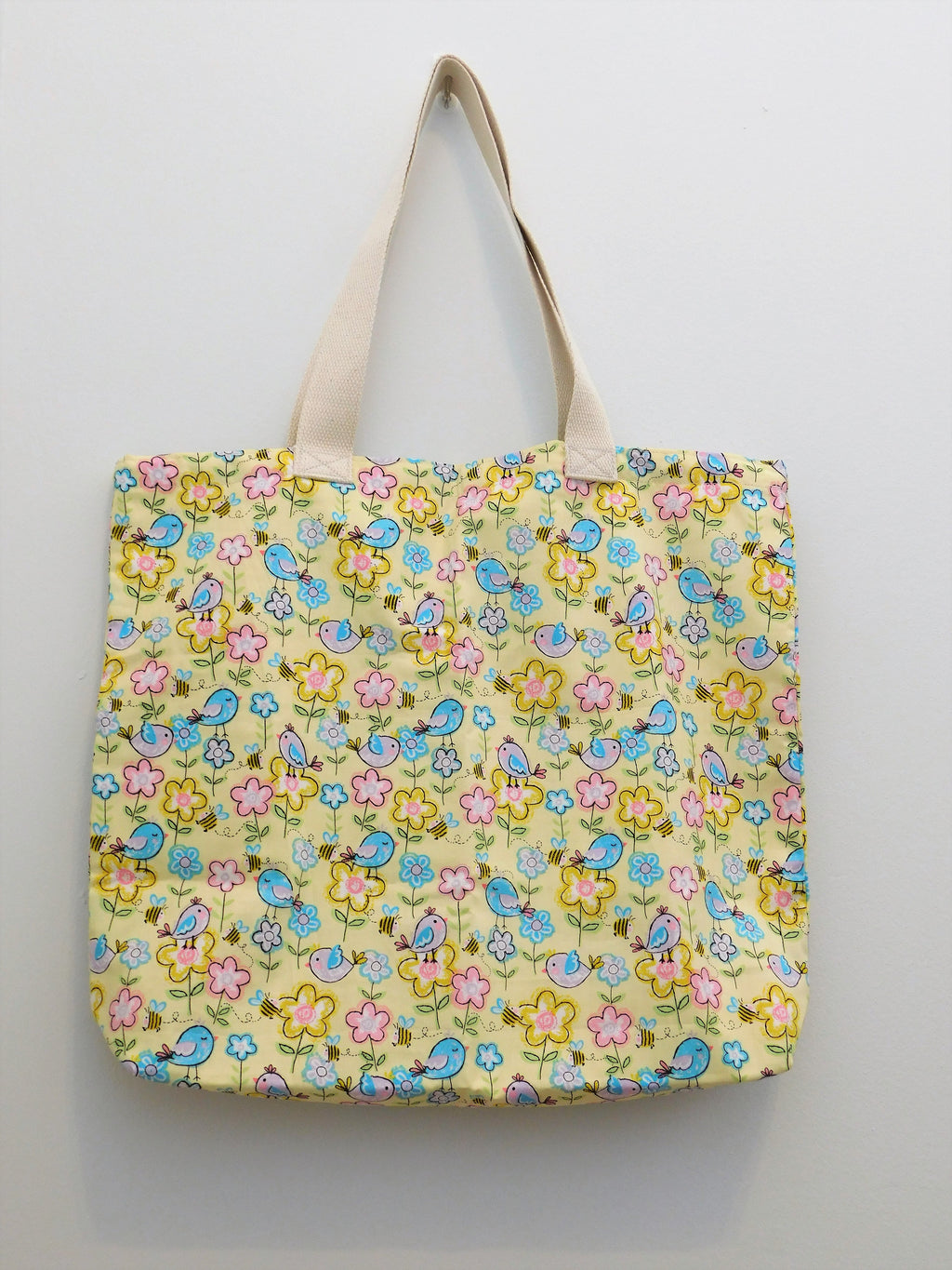 Beautiful handmade tote bag. Perfect for Spring time activities. Fabric, thread, trim and muslin fabric are 100% cotton. Machine wash cold, delicate cycle, tumble dry low, warm iron. Measuments around 16in x 19in x4in