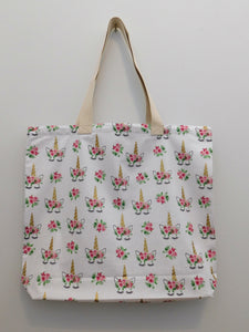 Cute white handmade unicorn with flower crown tote bag. This is a beautiful bag to take everywhere. Fabric, thread, white muslin lining and trim are 100% cottom. Measurements are around 19in x 16in x 3 1/2in.