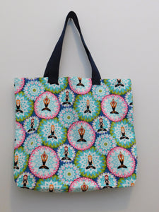 Yoga bag! Awesome bag to carry crafts or books.  Duck cloth with beautiful blues and yoga ladies doing poses inside mandalas. Fabric, thread and navy trim are all 100% cotton. Measurements are around 16in x 19in x 3in.  