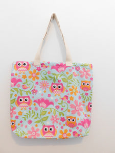 This beautiful handmade summer tote bag has cute owls, birds and flowers in hues of pink, orange and white in a light turquoise background with green leaves. Natural color trim, muslin lining, fabric and thread are all 100% cotton. Machine wash warm, delicate cycle, tumble dry low, use cool iron, do not bleach. Measurements are around 19in x 16in x 3in.