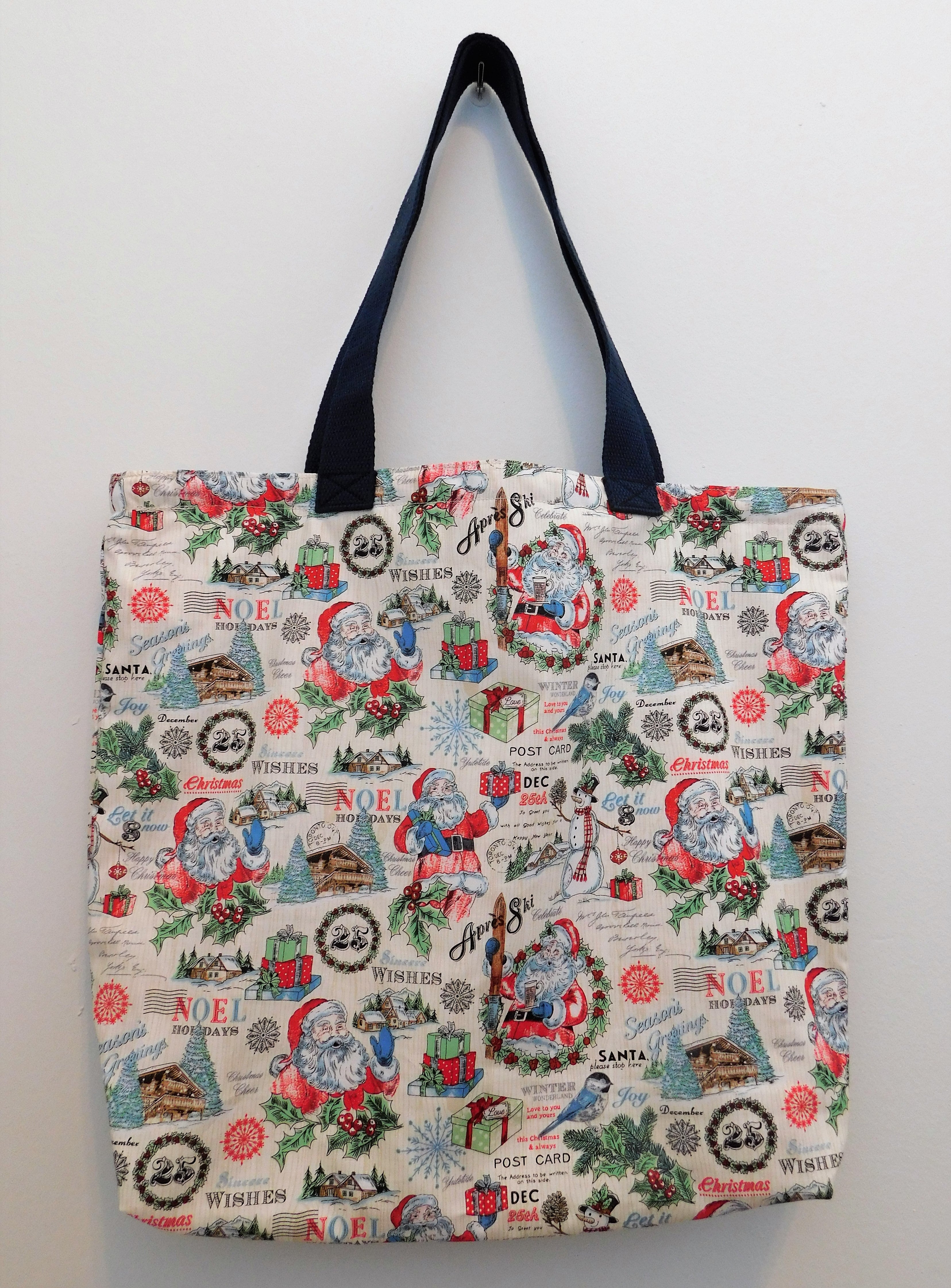 Be festive! Be merry! Seems like Santa has a ski lodge...let's go!!! Beautiful tote with Santa carrying gifts. Also, images of skies, presents and of course, a lodge. Perfect for a gift, travel, or just go with the season. All the materials from the fabric, muslin lining, thread, and trim are all 100% cotton. To care for your tote machine wash warm, tumble dry, remove promptly, do not bleach. Measurements are around 16in x 19in x 4in. 