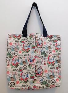 Be festive! Be merry! Seems like Santa has a ski lodge...let's go!!! Beautiful tote with Santa carrying gifts. Also, images of skies, presents and of course, a lodge. Perfect for a gift, travel, or just go with the season. All the materials from the fabric, muslin lining, thread, and trim are all 100% cotton. To care for your tote machine wash warm, tumble dry, remove promptly, do not bleach. Measurements are around 16in x 19in x 4in. 