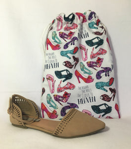 Pretty heels! This beautiful handmade shoe / travel bag is 100% cotton and is also lined with muslin fabric. The travel bag has images of beautiful red, pink, blue, turquoise high heels, along with the phrase "the higher the heels, the closer to heaven" in a white background and pull strings in the top to secure the content. This bag can be used for holding your shoes, underwear, socks, or just using it as a gift bag. Measurements are around 14in x 10in. (shoe not included)