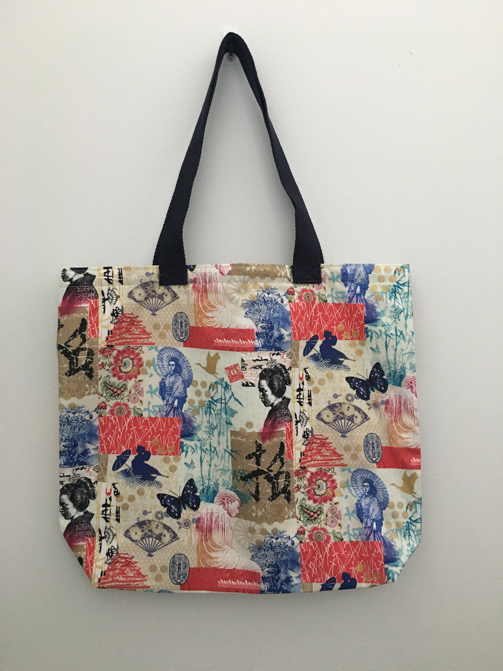 Beautiful Asian inspired handmade tote bag. This tote depicts a beautiful Asian lady, blue fan, pink, red, green flowers, golden swans, letters and statues. All the materials; fabric, muslin lining, thread, and trim are 100% cotton. To take care of your tote machine wash gentle cold, non-chlorine bleach, tumble dry low, cool iron. Measurements are around 16in x 19in x 4in.